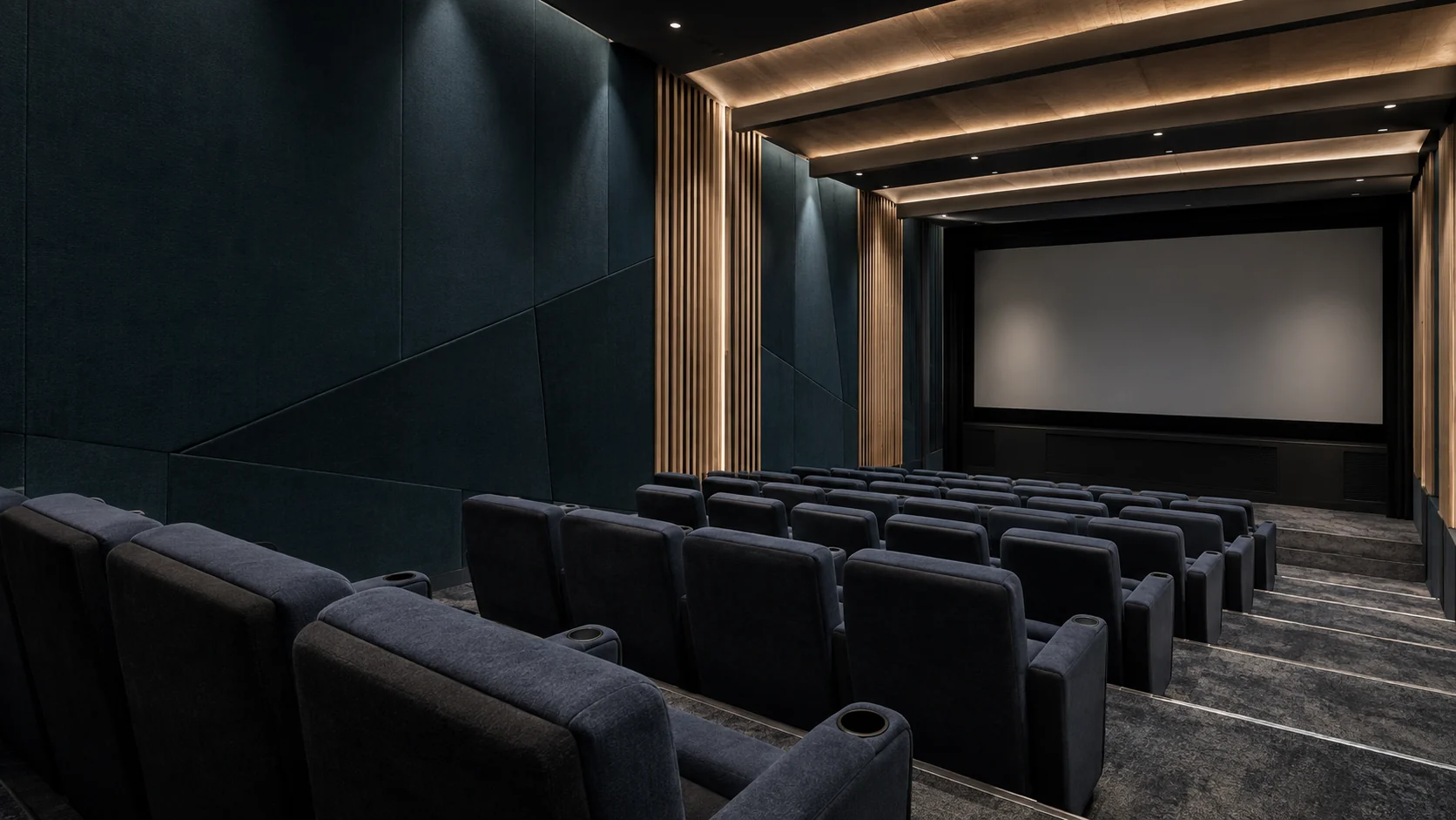 Illustrative cinema with sculpted acoustic wall panels, ceiling treatments and tiered seats